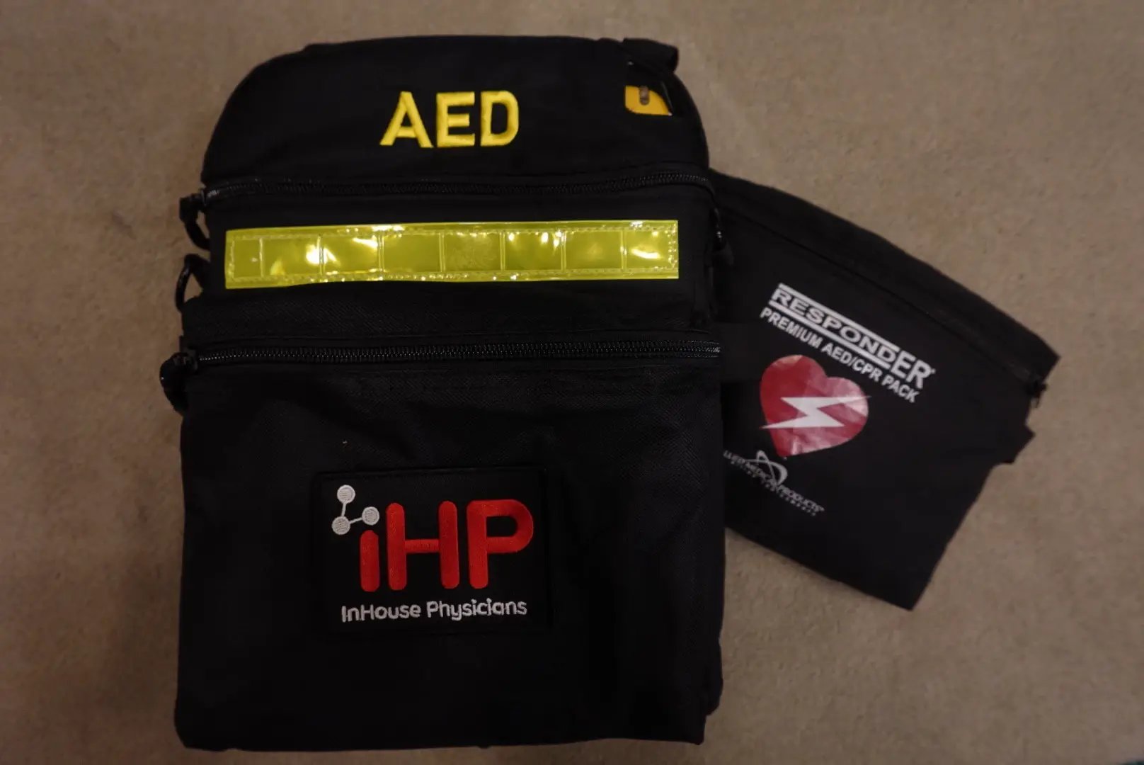 Branded AED and emergency response pack carried by on-site event medics from InHouse Physicians.