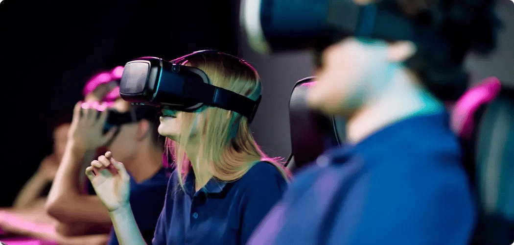 Attendee wearing a virtual reality headset during a mindfulness session in the wellness lounge at InHouse Physicians.