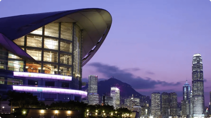 Large modern arena lit against a city skyline at dusk, a venue covered by first aid teams from InHouse Physicians.