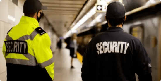 Security staff patrolling a transit station, part of the crowd safety planning supported by InHouse Physicians.