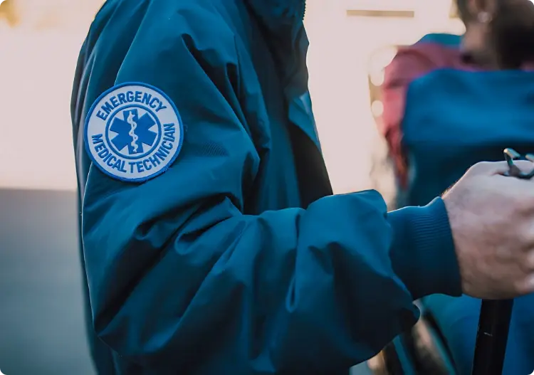 Emergency medical technician in uniform on duty at a public venue for InHouse Physicians.